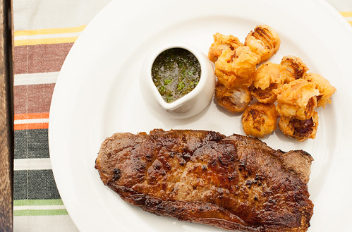 Steak with Chimichurri Sauce and fried baby Onions