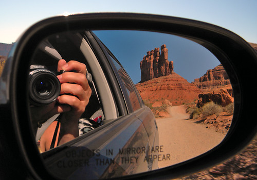 Car mirror reflecting the Valley of Gods in the American Southwest