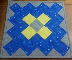 Yellow and blue granny square orphan block made into a table topper. We have our accreditation visit tomorrow,  so sewing decor relaxs me.
