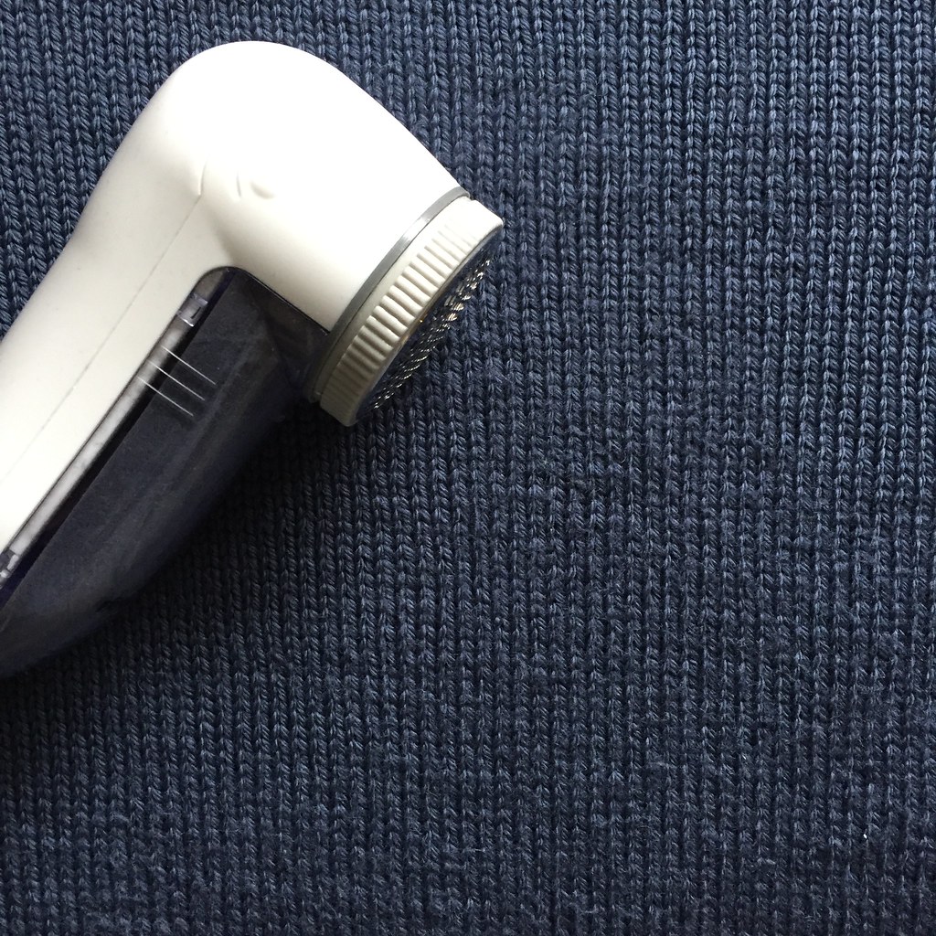 using the fabric shaver on bb's blue jumper