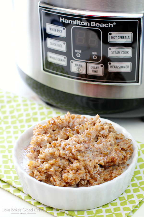 Brown Sugar and Cinnamon Breakfast Bulgur in a bowl with a slow cooker behind it.