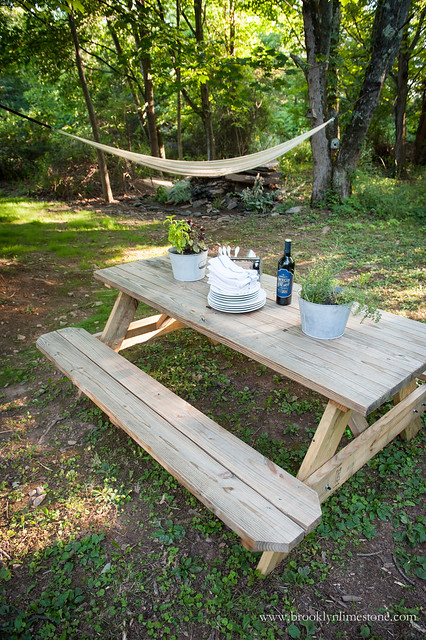 Picnic table next to firepit patio