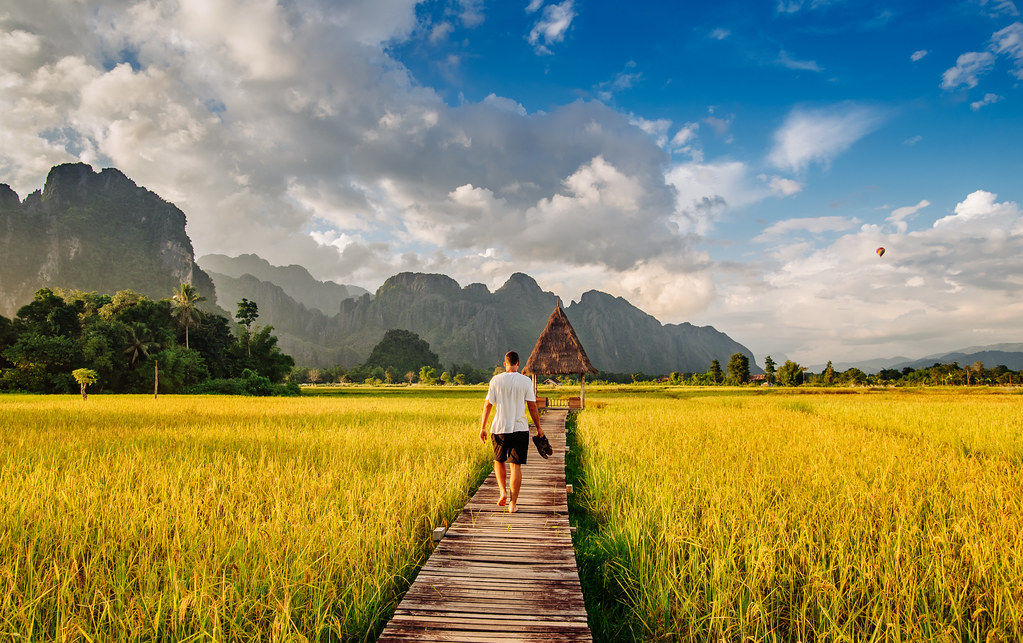 Boardwalk between rice fields in Vang Vieng, Laos  Ahmad 