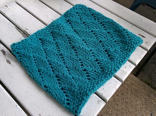 a bright blue cowl with a wave pattern