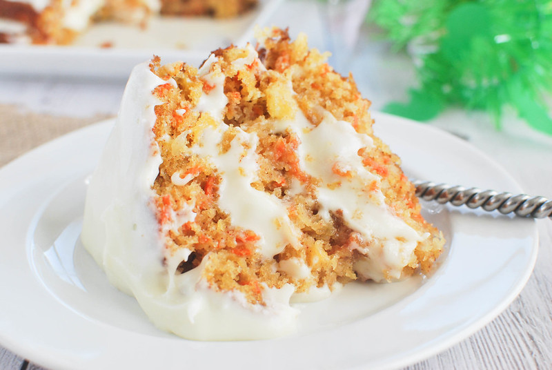 Carrot Cake with Buttermilk Glaze - delicious carrot cake with pineapple, coconut, and nuts! It's drizzled with a buttermilk glaze and topped with cream cheese frosting! 
