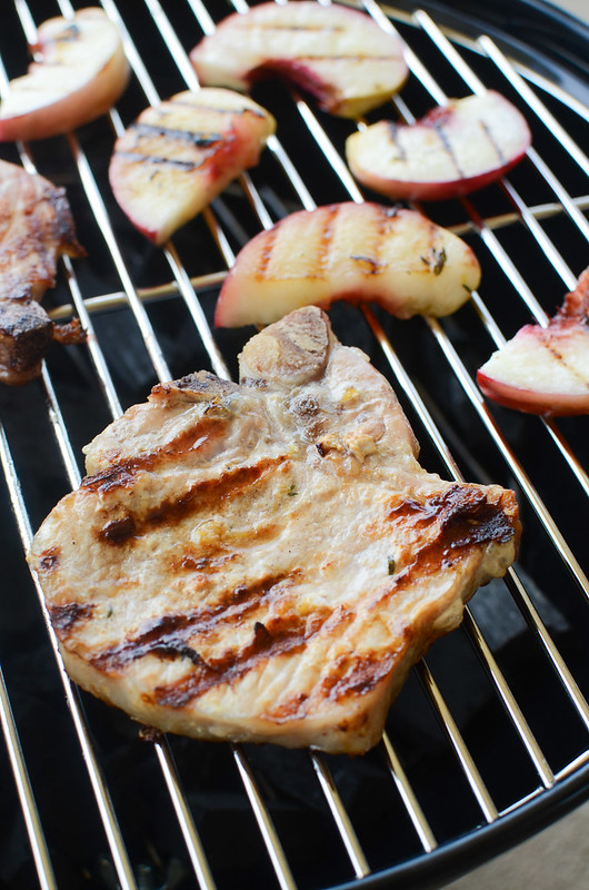 Grilled Lemon Thyme Pork Chops with Peaches - delicious and easy way to cook pork chops! Pork chops and peaches marinated in a lemon thyme marinade and grilled to perfection. Ready in 20 minutes!