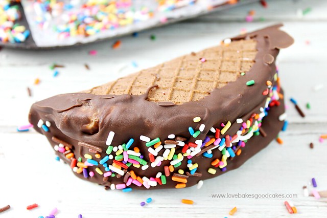 Choco-Taco laying on a cutting board with rainbow sprinkles.