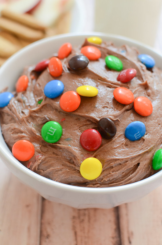 M&Ms Brownie Batter Dip - rich and delicious dessert dip! It starts with boxed brownie mix so it's quick and easy. Dip fresh fruit or graham crackers!
