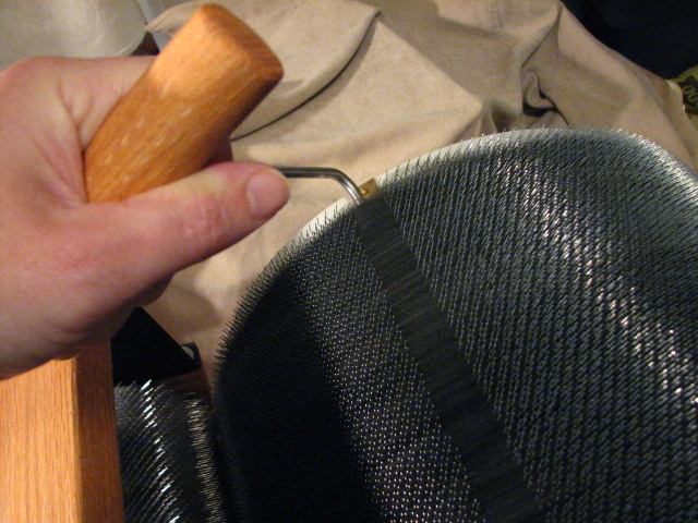Removing a batt from a drum carder