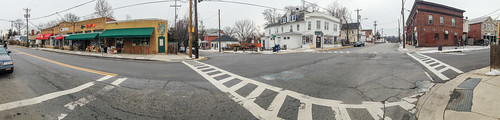 Panorama of the Glut, tan brick building with green awning, and the neighborhood they serve in Mount Rainier, Maryland. USDA Photo illustration by Lance Cheung.