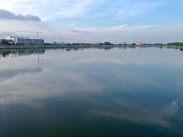 Morning reflections in the water reservoir near the bicycle track around Suvarnabhumi International airport in Bangkok, Thailand