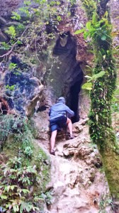 Tom climbing into the cave!