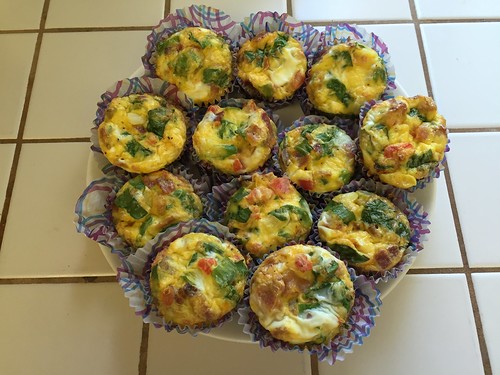 Egg muffins! Egg, cheese, spinach, tomato, bacon, green onion, onion, turkey sausage, bacon, and seasoning.