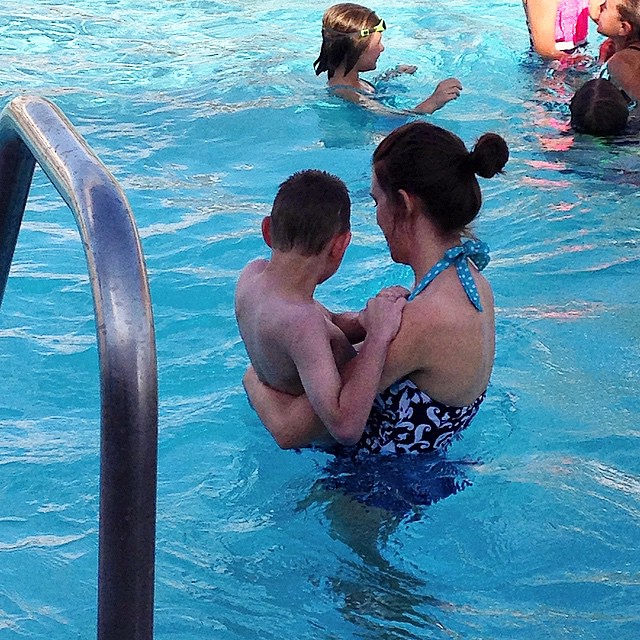 Ty is amazing. He wanted to go up on the huge slides. So he climbed the stairs five times to go down. He got freezing cold but wanted to go in the other part of the pool. This is his worker. She has become like family. She cradled him and swam him around