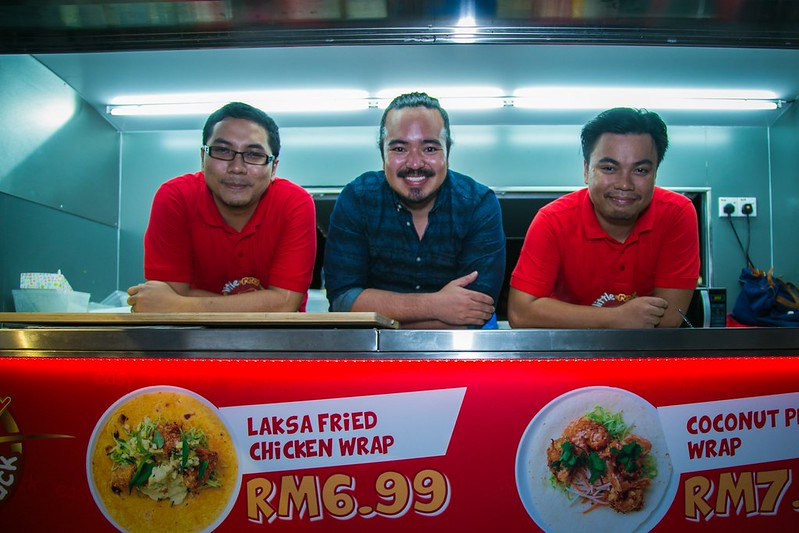 Master Chef Adam Liaw Smiles with the Team Behind the Little Red Food Truck