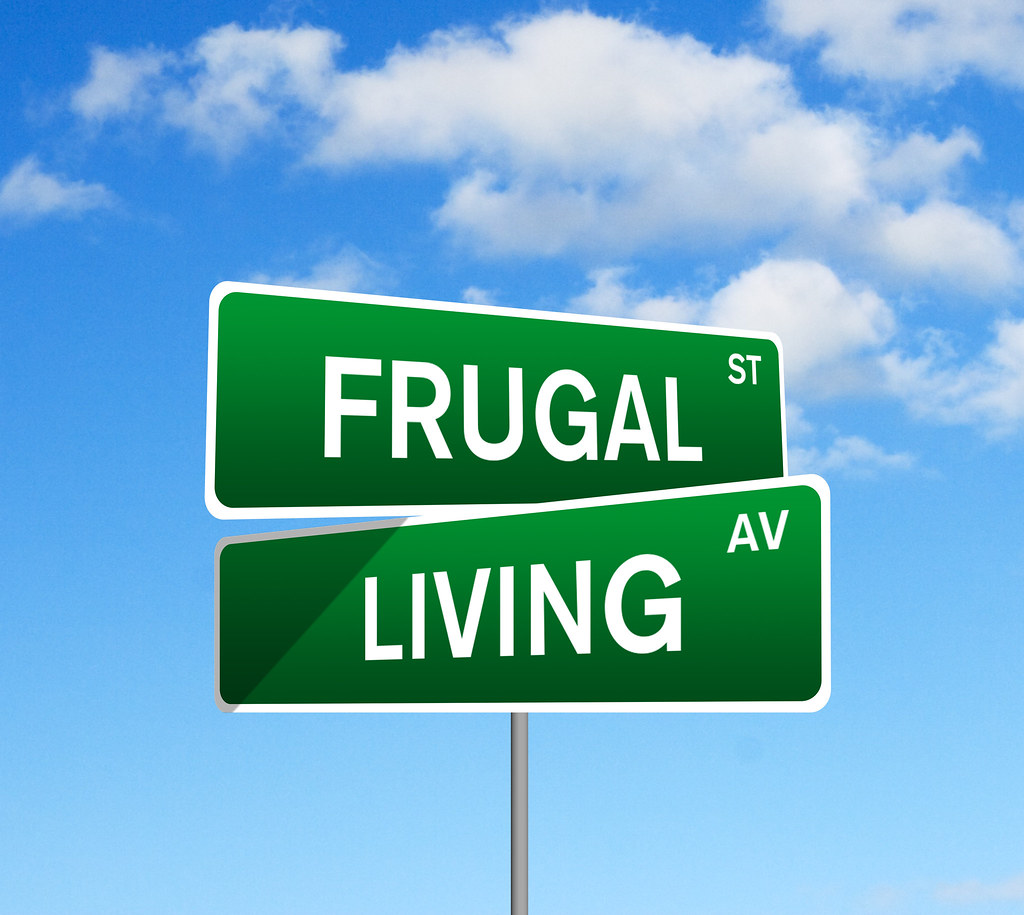 ... Frugal Living Street Sign Against Rolling Sky - by investmentzen