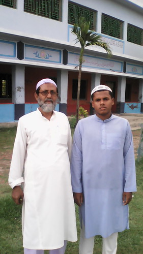 First ranker of Alim Examination 2015 Toriqul Islam with His teacher.