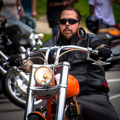 Black-leathered biker bedecked with big bodacious earrings